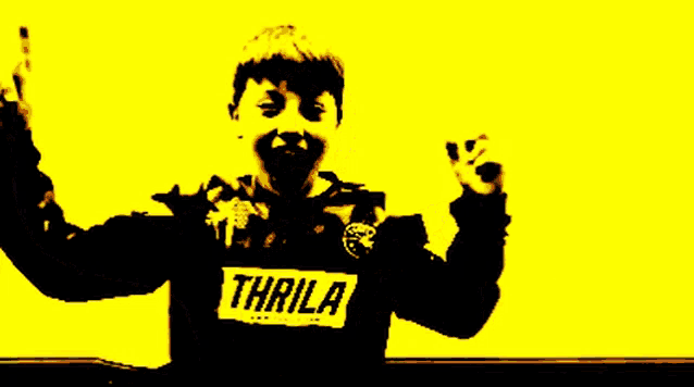 a young boy wearing a black jacket with the word thrilla on the front