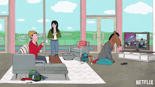a cartoon of a man sitting on a couch and a woman standing in front of a hollywood sign watching a tv