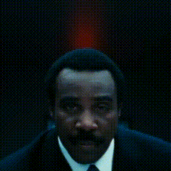 a close up of a red light on a dark background