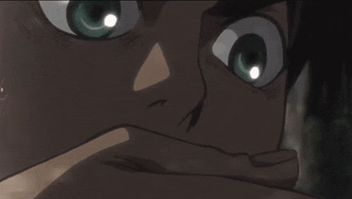 a close up of a man 's face with a tear running down his cheek
