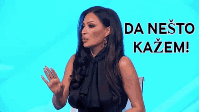 a woman in a black dress is standing in front of a blue background with the words da neste kazem written on it .