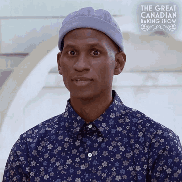 a man wearing a blue hat and a blue shirt is on the great canadian baking show show
