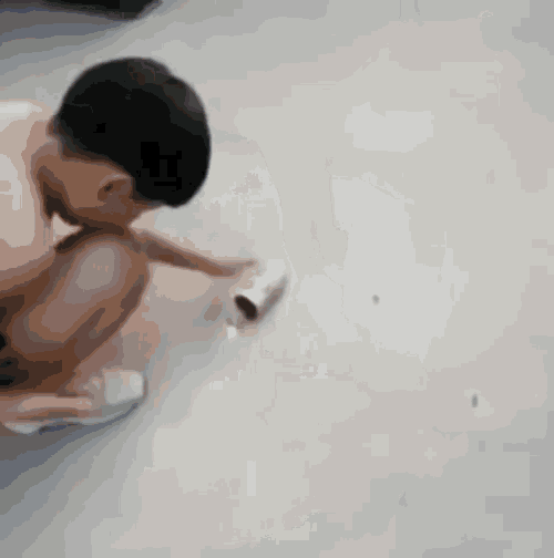 a blurry picture of a woman 's legs walking on a white floor