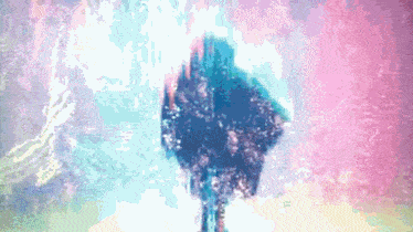 a blurry picture of a person 's face with a purple background