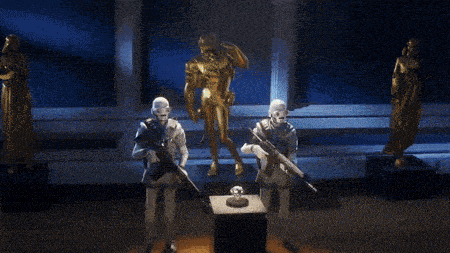 two soldiers holding guns in front of a statue with a name tag that says ' s.p.d. '