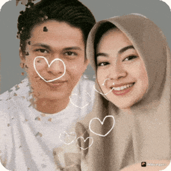 a man and a woman with hearts drawn on their face