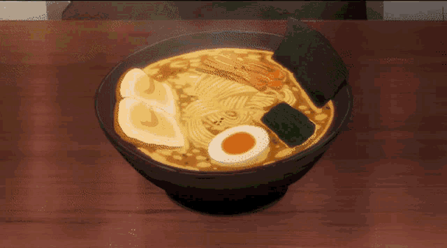 a bowl of ramen with eggs and vegetables on a wooden table