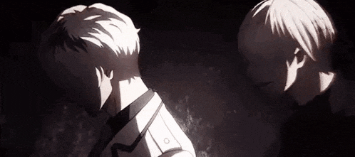 a couple of anime characters standing next to each other in the dark .