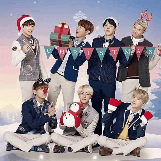 a group of young men are posing for a christmas picture