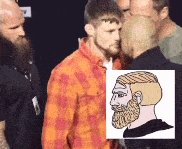 a man with a beard is standing next to another man with a picture of a man with a beard behind him