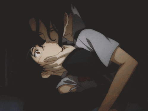 a man is holding a girl in his arms and covering her mouth