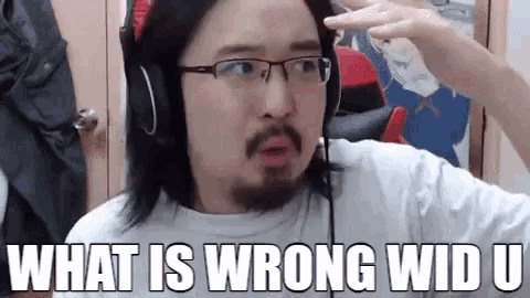 a man wearing glasses and headphones is asking what is wrong with u