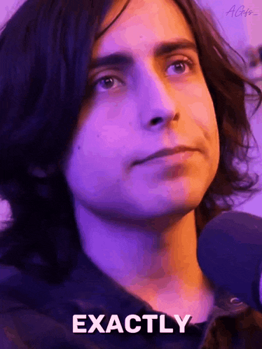 a close up of a person 's face with the words `` exactly '' written on the bottom .