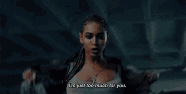 a woman in a crop top is standing in a dark room and says `` i 'm just too much for you . ''
