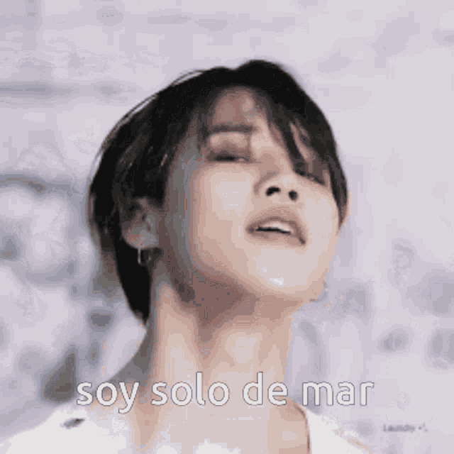 a close up of a man 's face with the words `` soy solo de mar '' written on it .