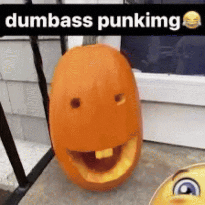 a pumpkin with a face carved into it is sitting on the ground next to a smiley face .