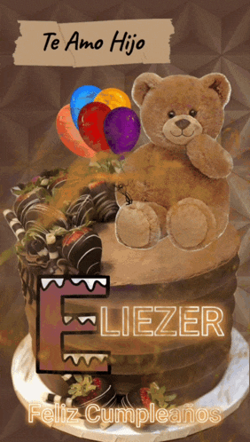a teddy bear sits on top of a chocolate cake with the name feliz cumpleanos on it