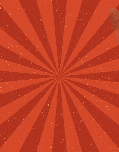 a kitten wearing an orange shirt is laying on a red striped background