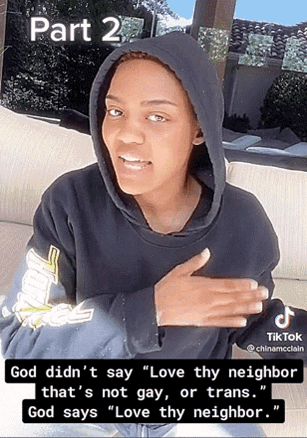 a woman wearing a black hoodie is talking about love