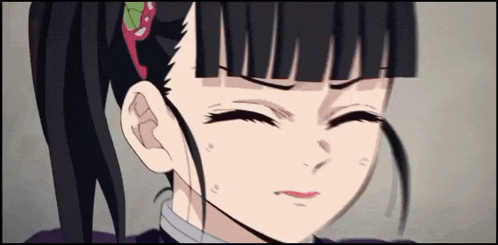 a close up of a girl 's face with a surprised look on her face
