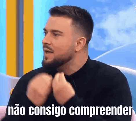 a man with a beard is making a gesture with his hands and says não consigo compreender