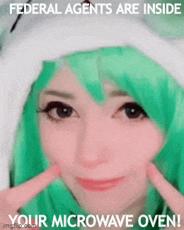 a girl with green hair and a white hat says federal agents are inside your microwave oven !