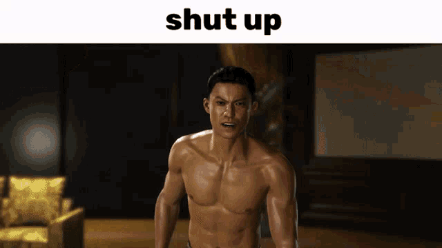 a shirtless man is standing in front of a sign that says " shut up "