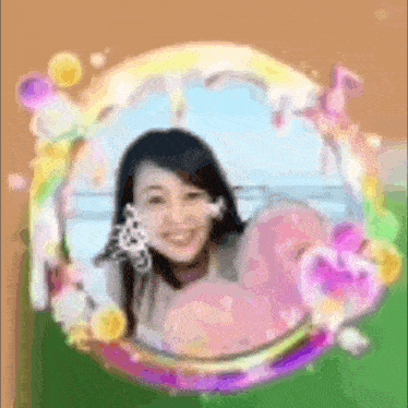a blurry picture of a woman in a circle with flowers and hearts