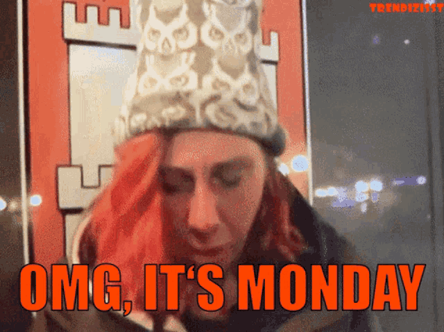 a woman with red hair says omg it 's monday in orange letters