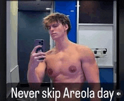 a shirtless man is taking a picture of himself in a bathroom .
