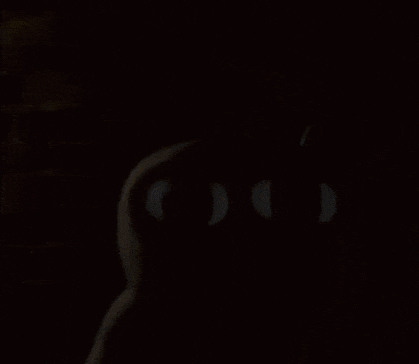 a close up of a cartoon character 's face with big teeth