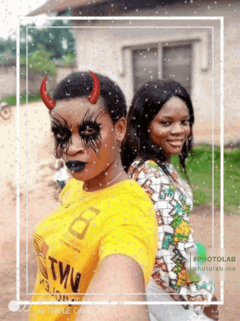 two women standing next to each other with one wearing a yellow shirt that says twu on it