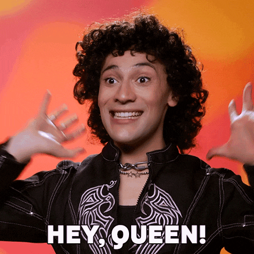 a man with curly hair says " hey queen "