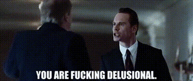 a man in a suit and tie is talking to another man in a suit and tie .