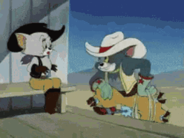 a cartoon of tom and jerry wearing cowboy outfits