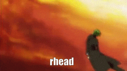 a blurry picture of a man standing in front of a red sky with the word rhead written on it .