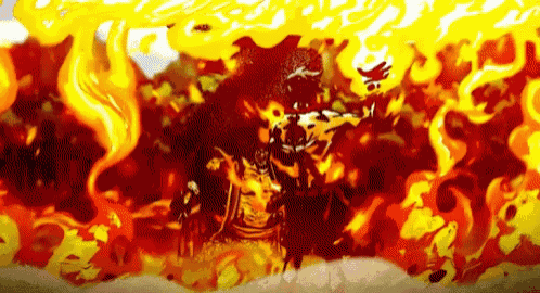 a man is standing in the middle of a fire surrounded by flames .