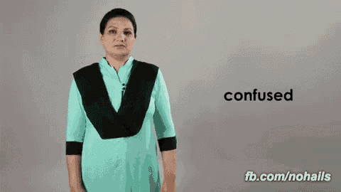 a woman in a blue dress with a black scarf around her neck is confused