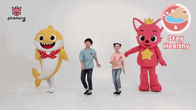 a pinkfong advertisement with a shark and two children