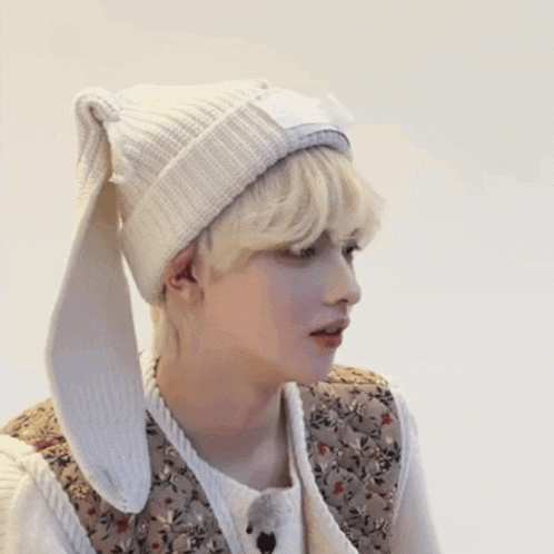 a person wearing a beanie with long ears