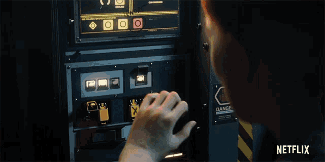 a netflix ad shows a person pressing a button on a machine