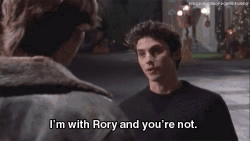 a man talking to another man with the words " i 'm with rory and you 're not "