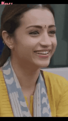 a close up of a woman 's face with the words kulfy on the bottom right