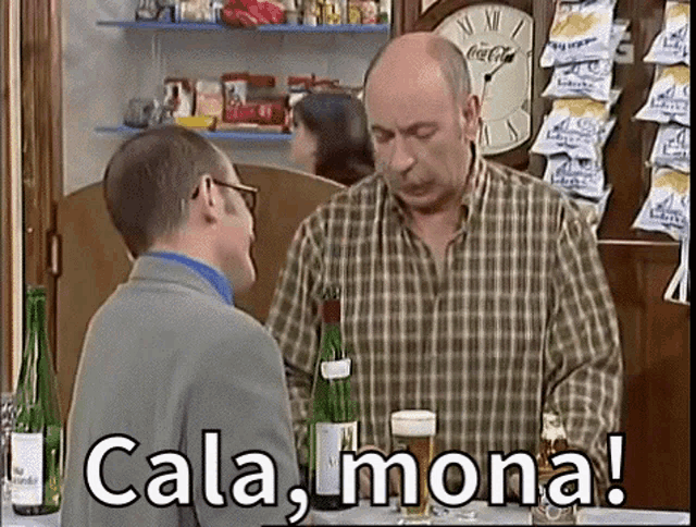 two men are standing next to each other and one of them is holding a glass of beer and says cala mona