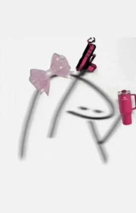 a headband with a pink bow and a cell phone on it .