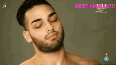 a shirtless man with a beard and mustache is making a funny face .