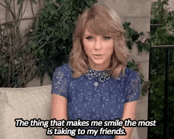 a woman is sitting on a couch with the words " the thing that makes me smile the most is taking to my friends " on her face