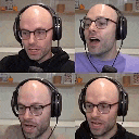 a bald man wearing glasses and headphones is speaking into a microphone .