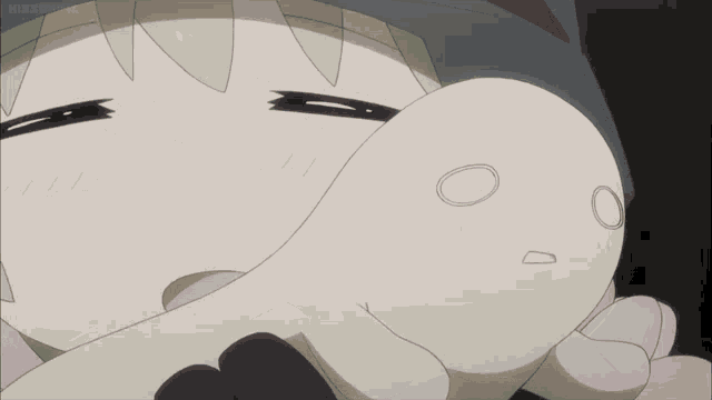 a close up of a cartoon character holding a white object with a circle on it