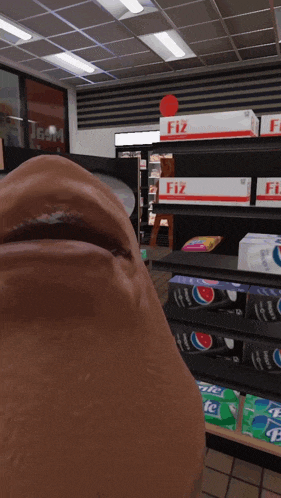 a man 's face is in front of a shelf of fiz boxes